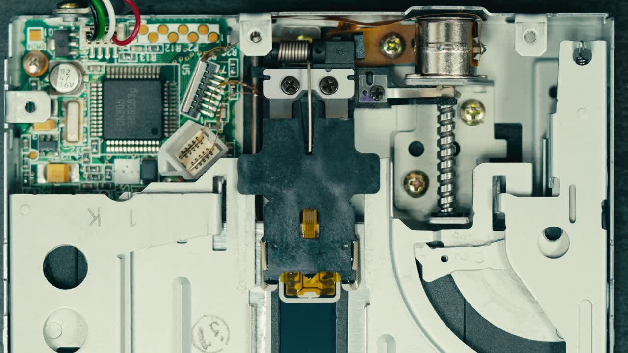 Floppy disc FDD close up, Using diskette for old PC computer macro. Archive programme or Music recorder, playing retro computer games. Vintage device for office, obsolete technology. . High quality 4k footage