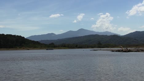 Idyllic-landscape-with-mountains-and-rain-forest-surrounding-the-Tarcoles-River-in-Costa-Rica