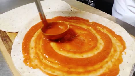 chef preparing pizza