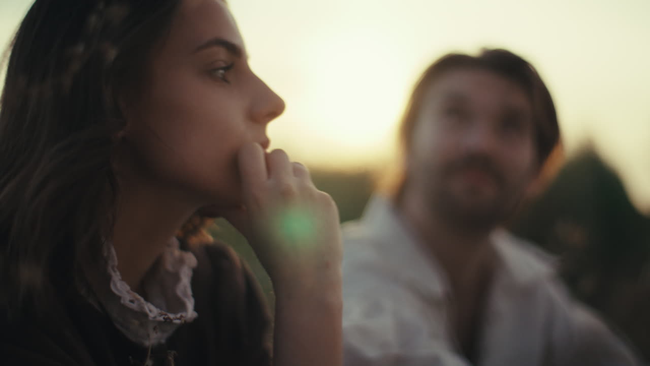 Thoughtful Conversation in Golden Hour Light