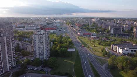 AERIAL-Panning-to-side-shot-over-a-Highway-in-a-Soviet-Planned-Residential-District-Seskine-in-Vilnius,-Lithuania