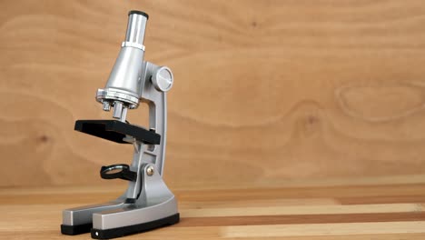 Close-up-of-microscope-on-a-table