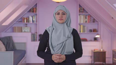serious muslim woman looking at the camera