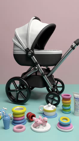 a modern baby stroller with various baby toys, featuring close-ups of the stroller's design