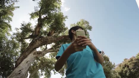 Cute-boy-playing-with-his-smartphone