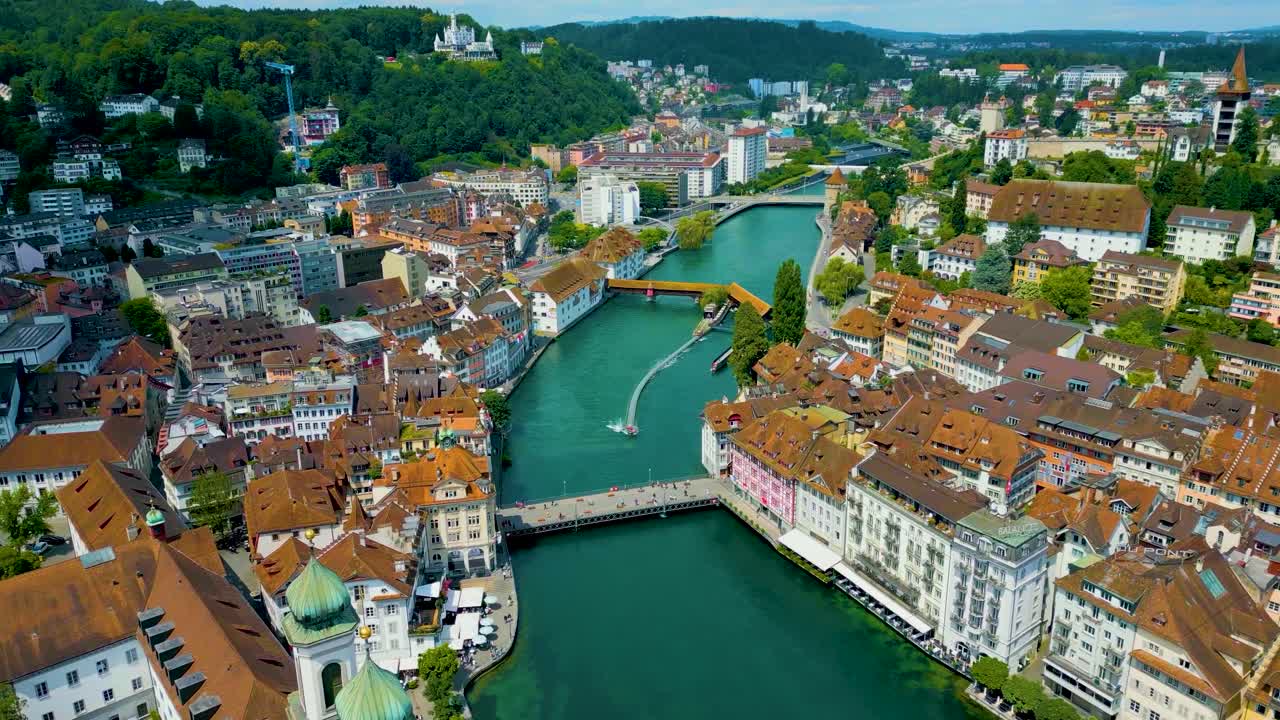 4K Drone Video of the Spreuerbrücke Bridge and Lucerne Needle Dam on the Reuss River near Lake Luzerne in Lucerne, Switzerland