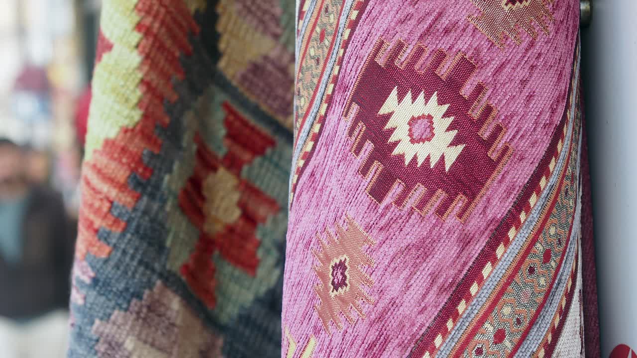 Close-up of Rolled Traditional Rugs with Colorful Patterns