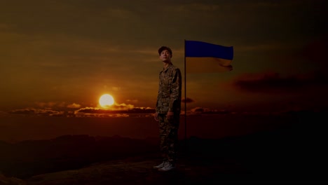 ukrainian soldier with flag at sunset