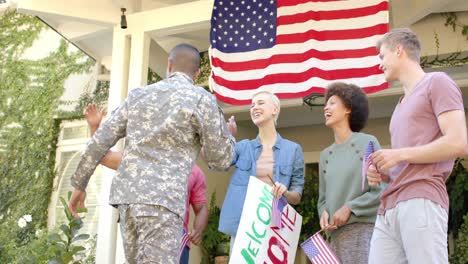 happy diverse male soldier embracing his friends with american flag