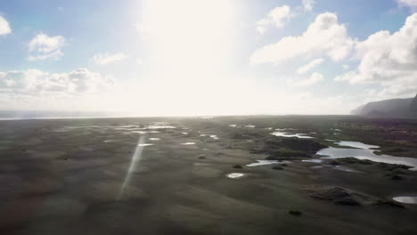 panorama view of  black sandy whatipu beach near huia reserve, new zealand