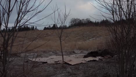 Preparing-No-Dig-Garden-On-Field---Man-Laying-Soil-Mix-On-Top-Of-Cardboards-In-Norway