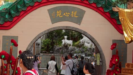 people exploring the temple entrance in hong kong