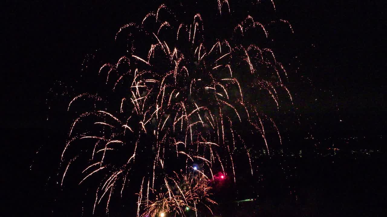 Aerial shot of a colorful fireworks show that lights up the night sky