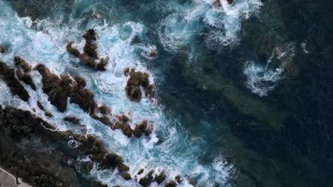 volcanic pools of porto moniz in madeira portugal footage with drones of cliffs, ocean, natural bathing spots, and houses filmed at sunset