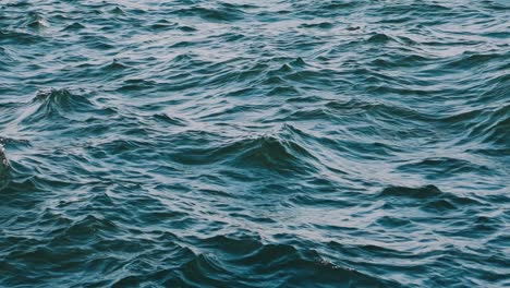 amazing water background at storm. waves swaying on the sea water. beautiful blue water of the ocean with waves. slow motion.