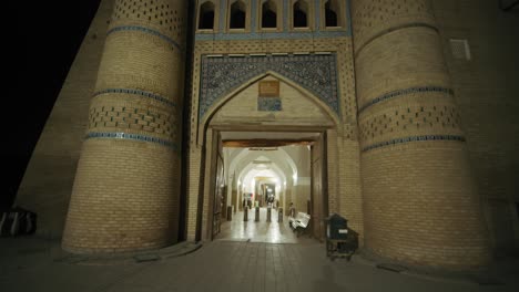 night view of a historic city gate in uzbekistan