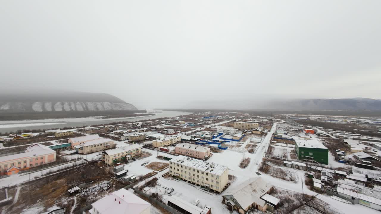 Glimpse the serene beauty of Yakutia as a drone captures the quiet transformation brought by the season's first snowfall. The landscape is blanketed in white, showcasing the tranquility of winter.