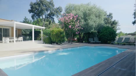 tracking shot of a sumptuous swimming pool of a beautiful villa