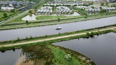 aerial footage of the yacht or boat crossing the canal