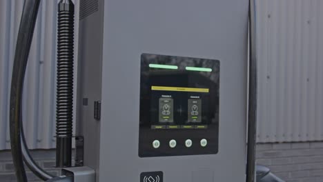 Beautiful close dolly of the display of an electronic vehicle charging station