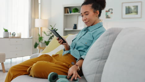 woman listening to music at home