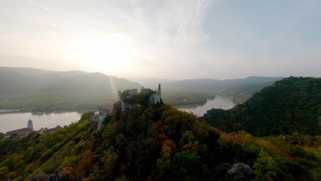 fpv gliding around the ruin of dürnstein before dynamically descending into the city