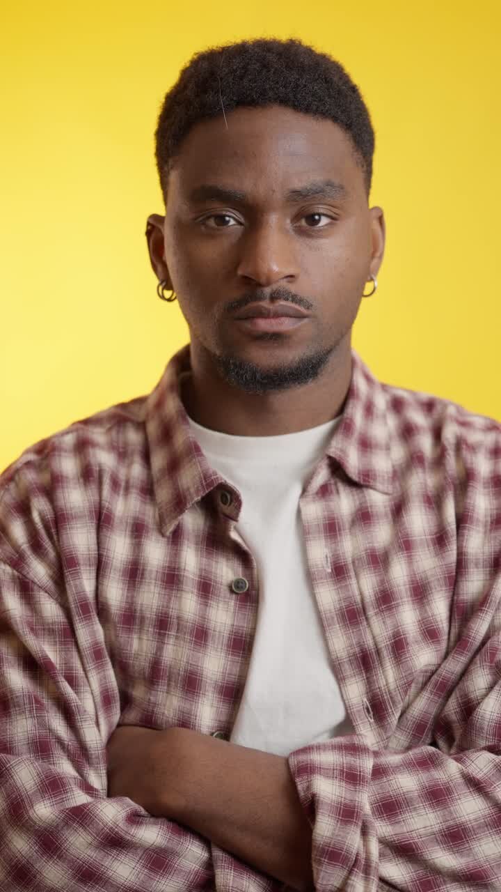 Portrait of a man with a beard in a plaid shirt