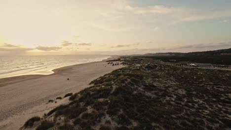 Exotic-coast-of-Costa-De-Caparica-in-Portugal,-aerial-sunset-view