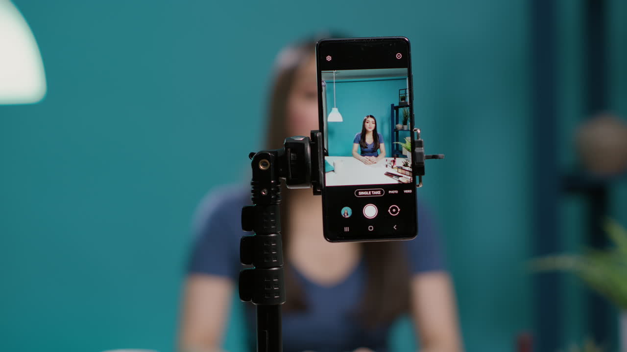 Content creator recording lifestyle vlog on filming camera