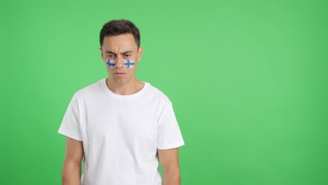 dignified and serious man with finnish flag painted on face