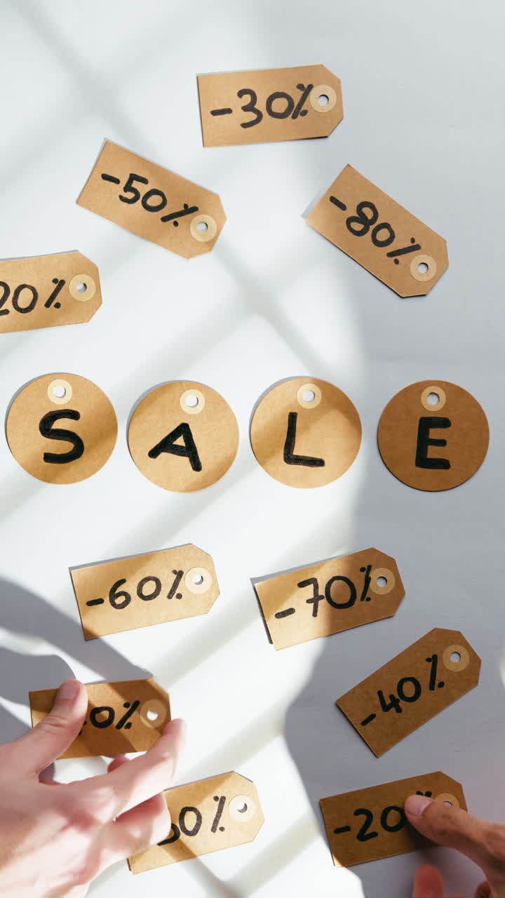 Sale written on a white background and discount tags placed for customers
