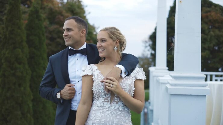 Bride and groom pose dramatically at luxury hotel