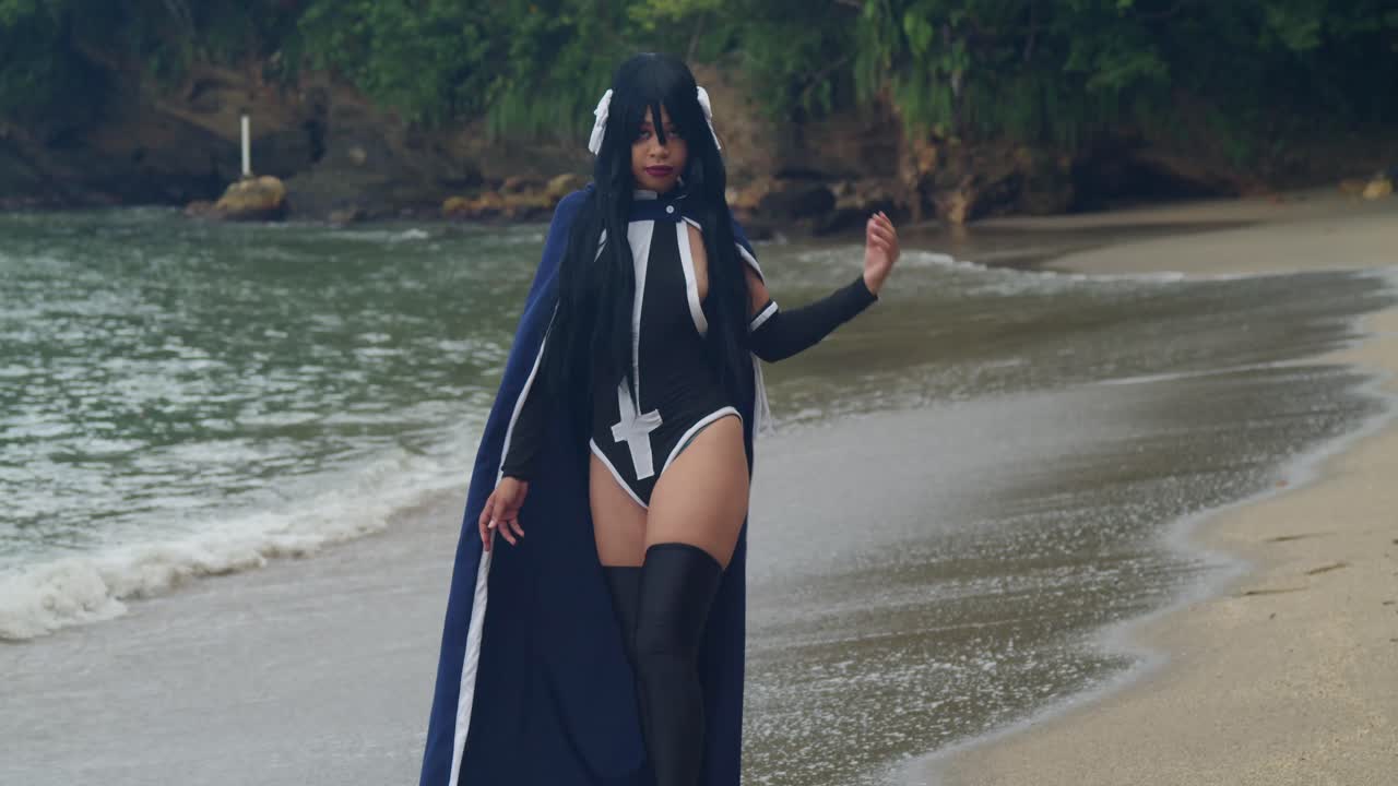 Serene photography of a fair-skinned girl in fantasy attire, gazing out at the horizon of a crystal-clear Caribbean sea