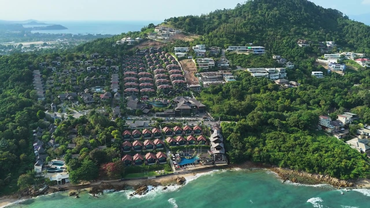 Turquoise beach and resort shoreline at Bo Phut Koh Samui, drone medium tracking right tilt upward