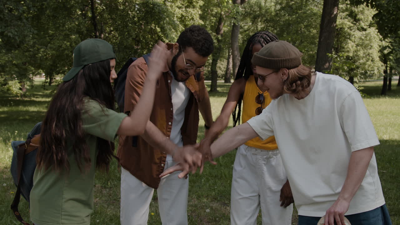 Diverse Group of Friends Bonding and Showing Teamwork in a Park