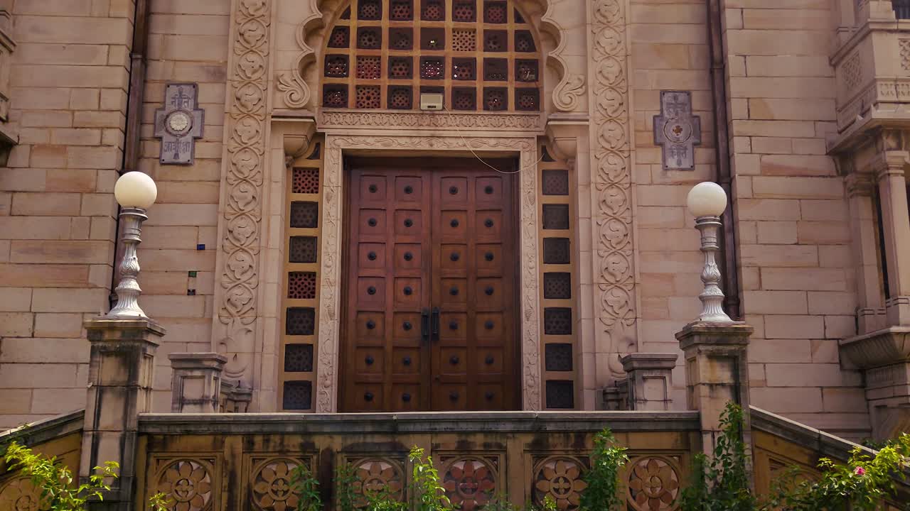 Close-up footage of Kirti Mandir's ornate entrance and intricate architectural details in Vadodara, Gujarat. Ideal for cultural, historical and travel projects.