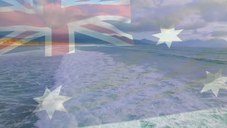 digital composition of australia flag waving against aerial view of waves in the sea