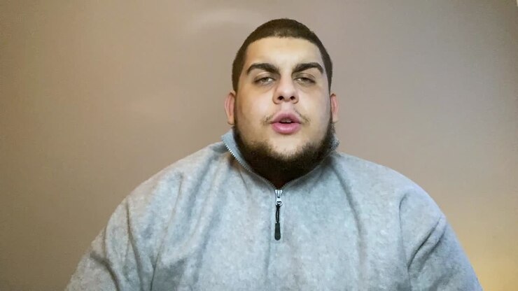 Young University Student Asking Question During Video Lecture