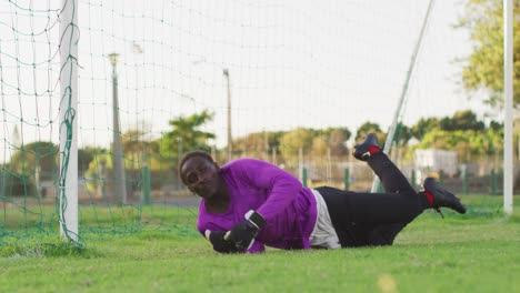 video of african american football male goalkeeper with ball