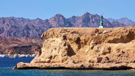 Coast-with-clifs-and-luxorious-yachts-in-Sharm-El-Sheikh,-Egypt