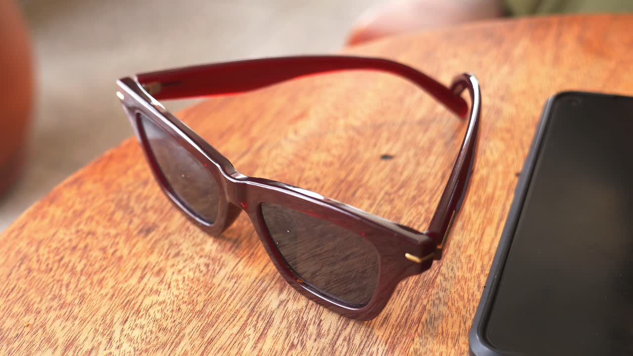 Red Sunglasses on Wooden Table