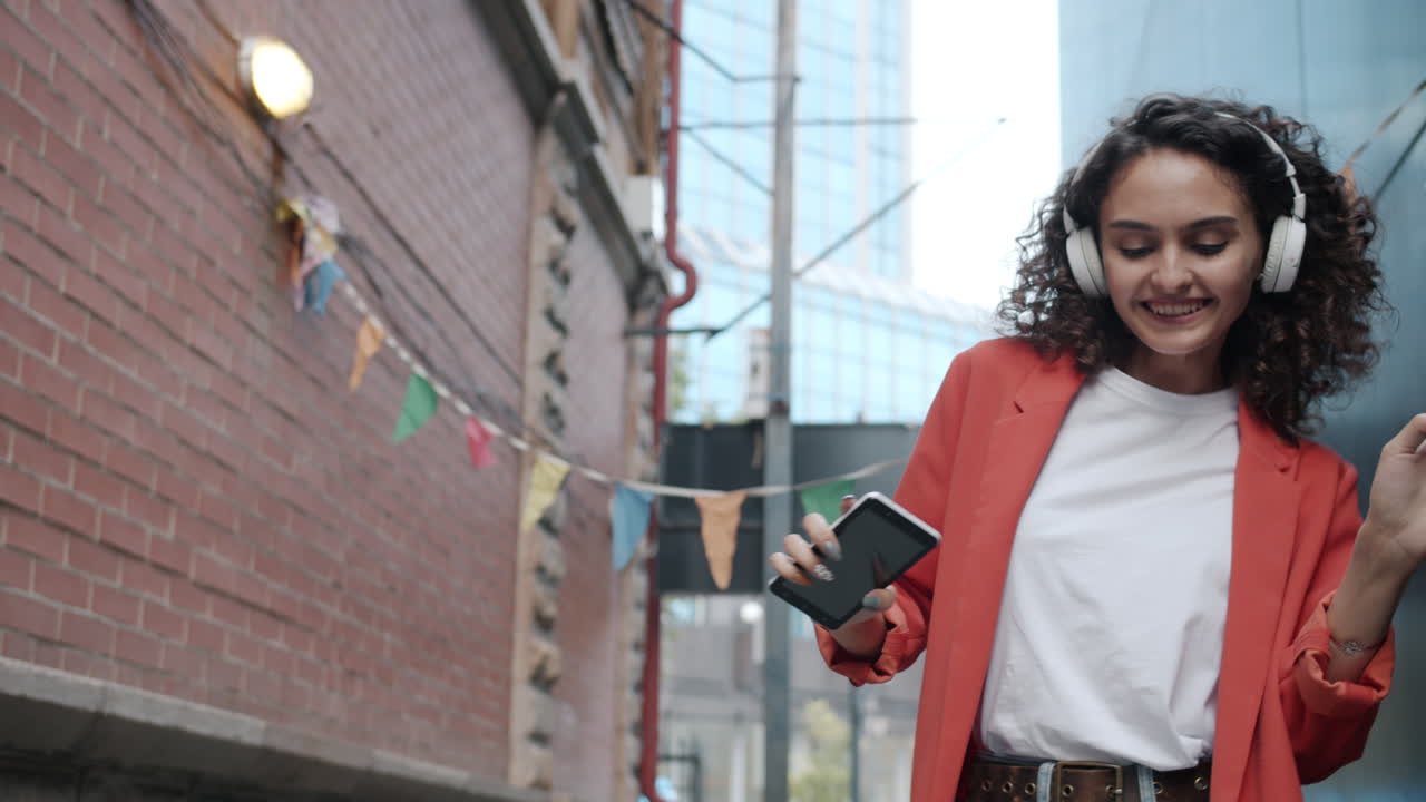 Happy Woman Dancing in the City