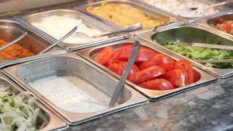 self-service salad bar with various toppings