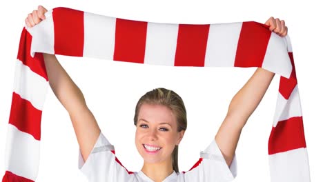 Animation-of-smiling-female-sports-fan-holding-red-and-white-scarf,-on-white-background