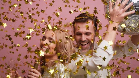 Happy-couple-dancing-and-drinking-champagne