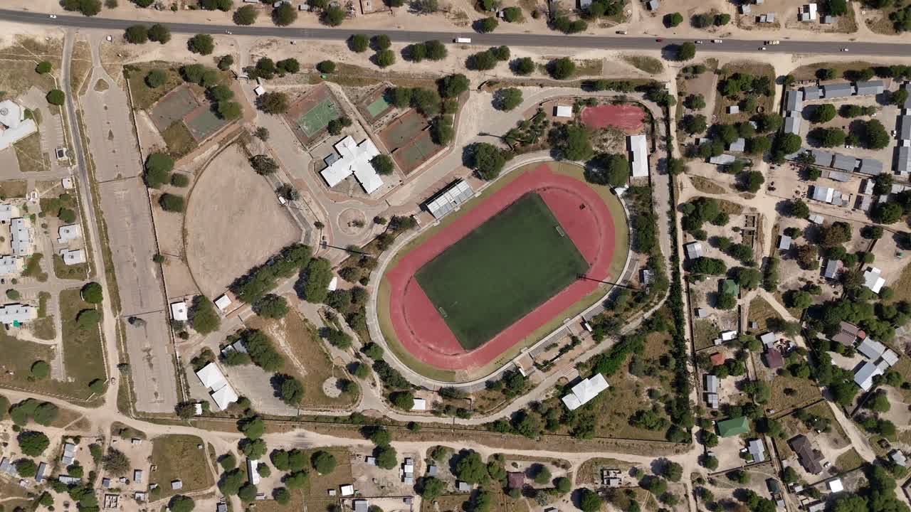 Maun Sports Complex Top - Down - 4K slow smooth Establishing Drone shot