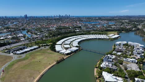 stunning drone footage of gold coast's emerald lakes and surfers paradise skyline, capturing vibrant cityscapes, lush greenery, and sparkling waters from an aerial perspective.