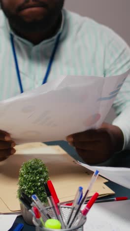 Vertical Video Close up of diverse staff collaborating on data forecasting and analysis
