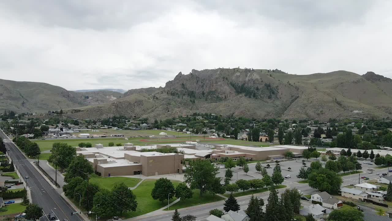 Cascade mountains and Wenatchee town in Washington State, USA. Aerial view.