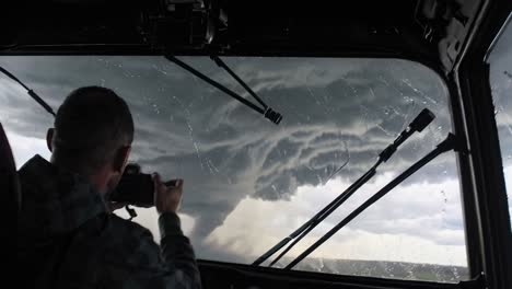 photographer captures a tornado from a truck